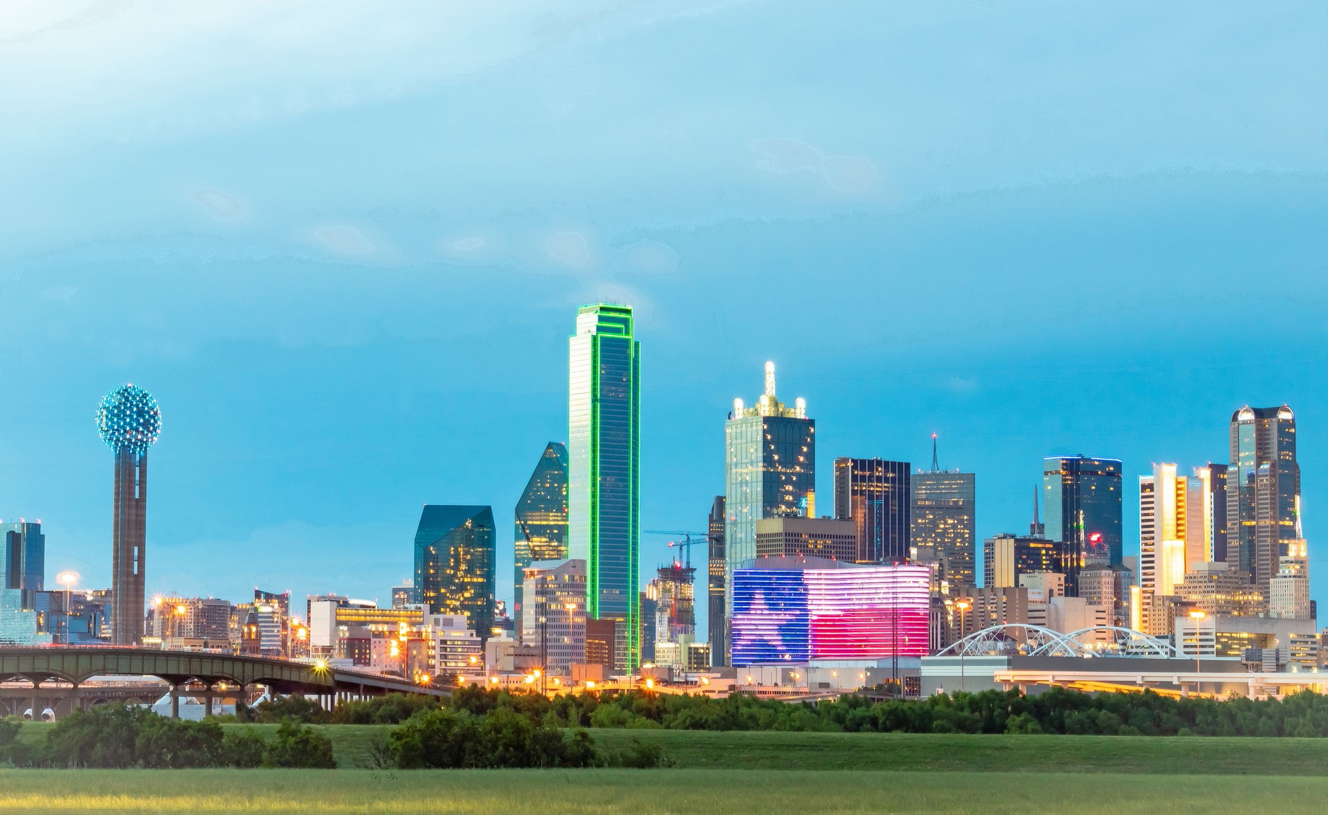 Illuminated colorful downtown Dallas Texas city skyline buildings. Photo taken in the evening at blue hour twilight